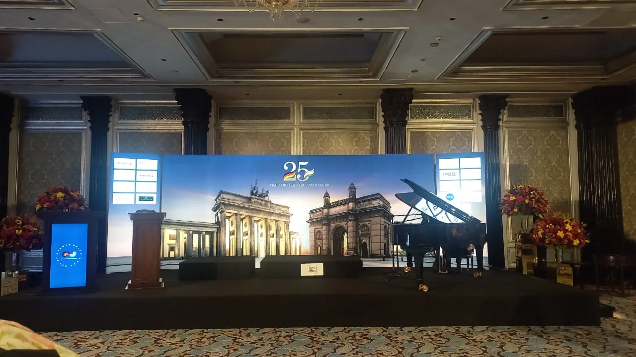 Anniversary event stage with integrated panoramic LED scenery, lectern and grand piano